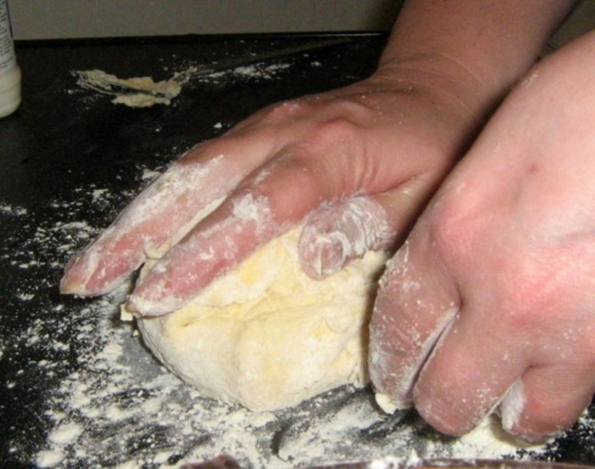 To make the shortcrust pastry, add the butter into the flour and mix well with your hands.
