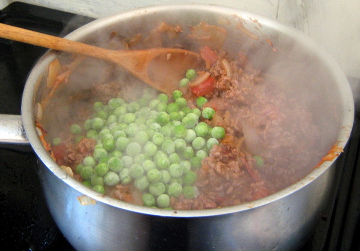 Add the frozen peas to the pot.