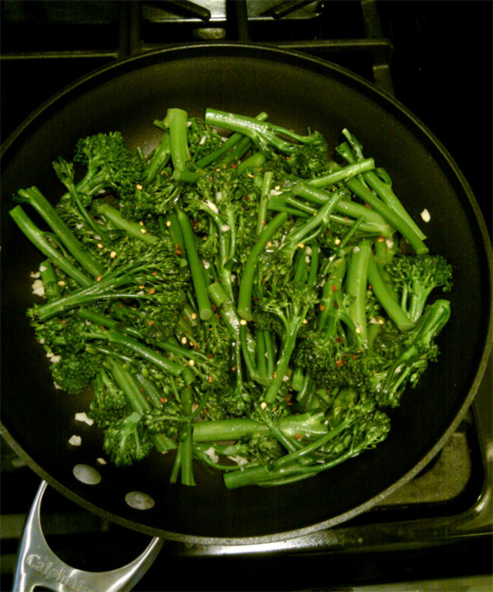 Stir-frying the broccolini.