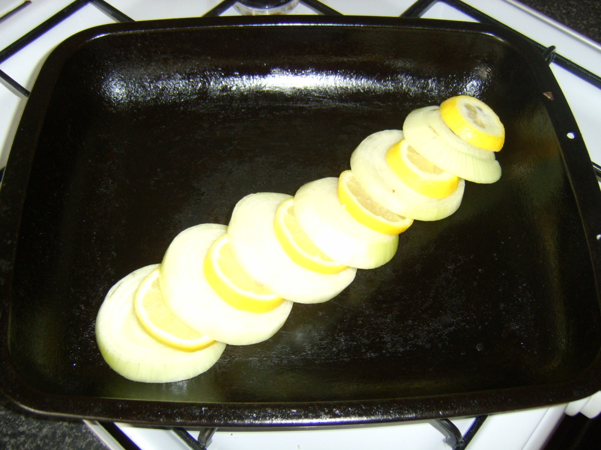 Sliced lemon and onion serve as a bed for the pike