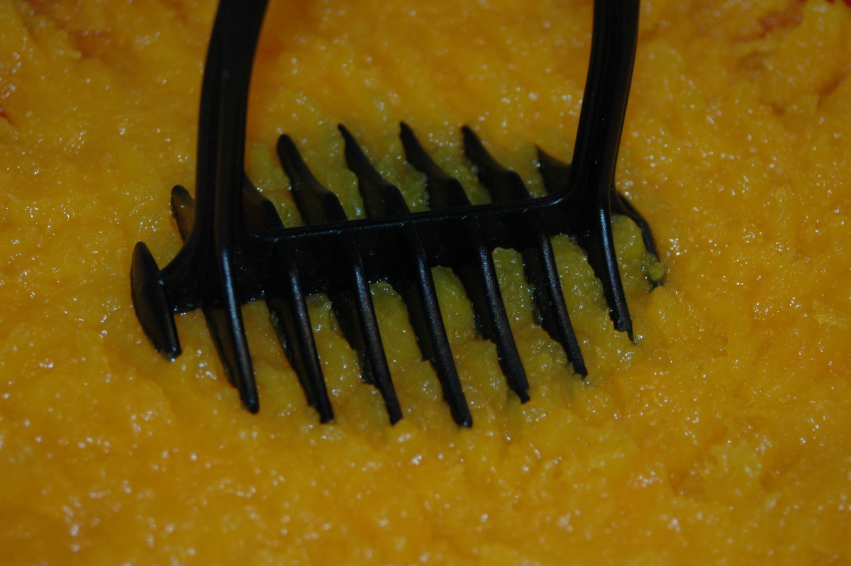 Use a potato masher to mash the pumpkin to the desired consistency.