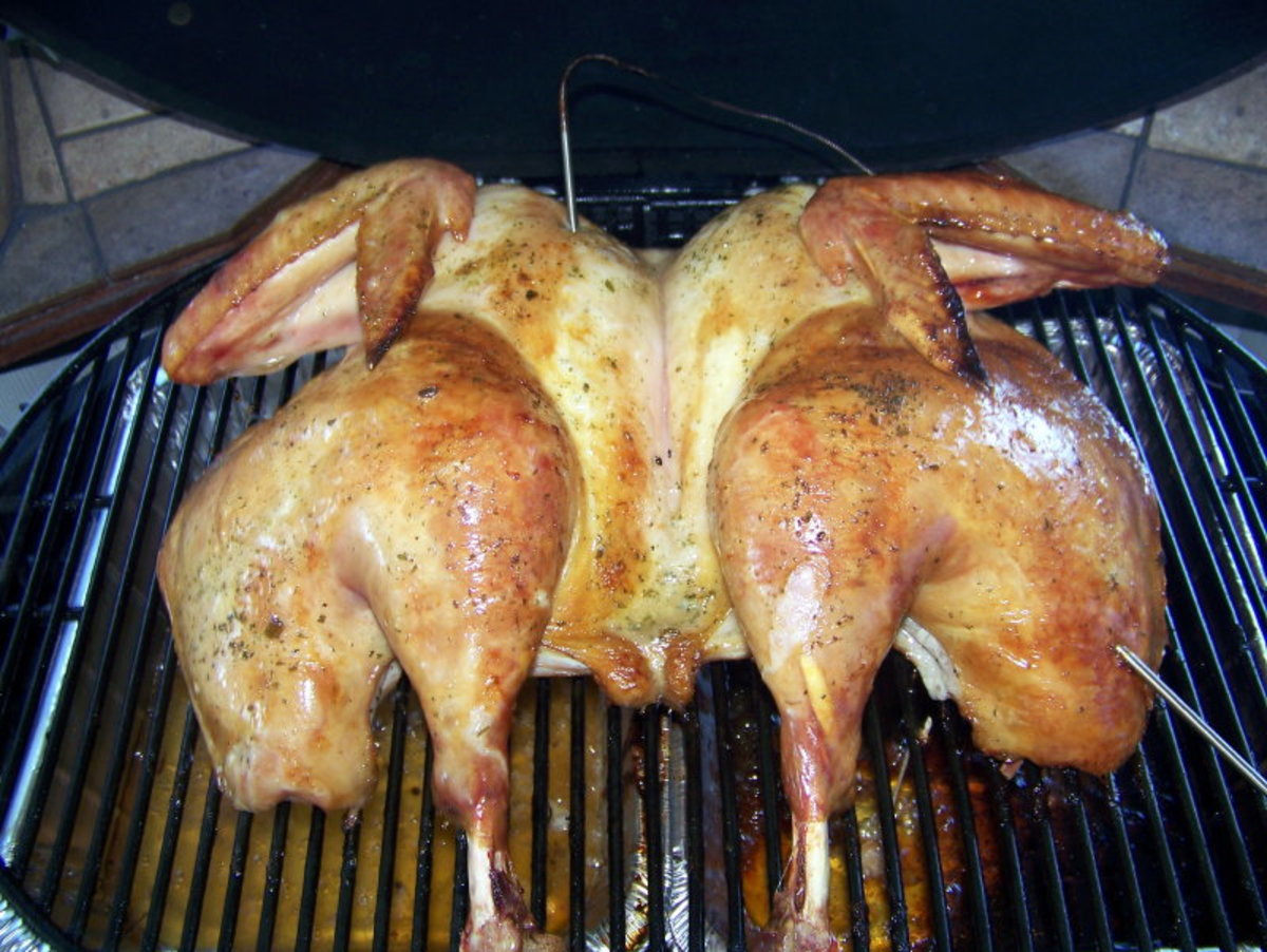 A spatchcocked bird on the grill—in this case, a turkey grilled without weights