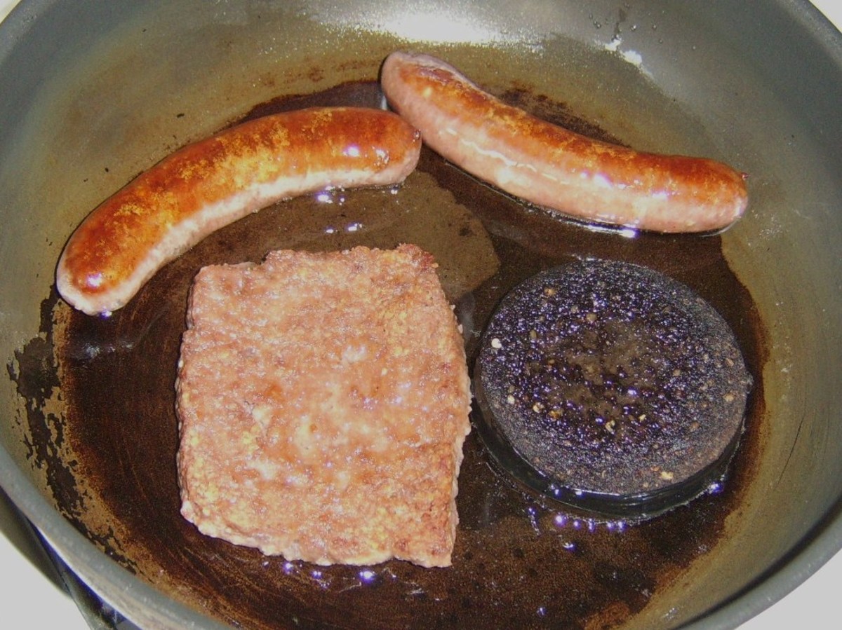 Frying the sausages and black pudding