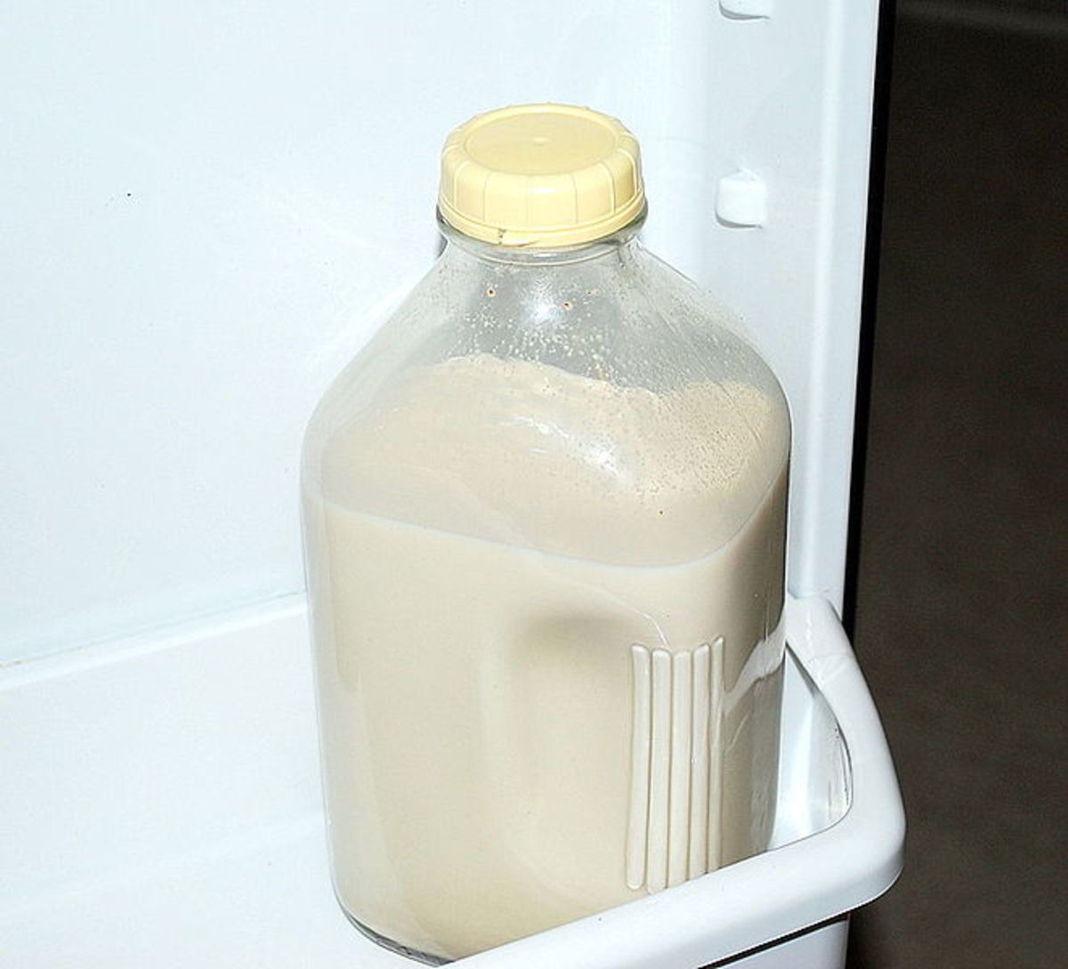 A jug of almond milk in the fridge