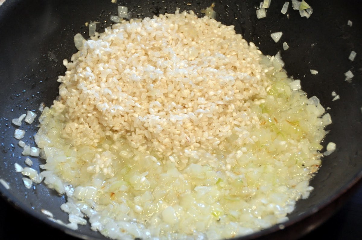 Add rice over the onions.