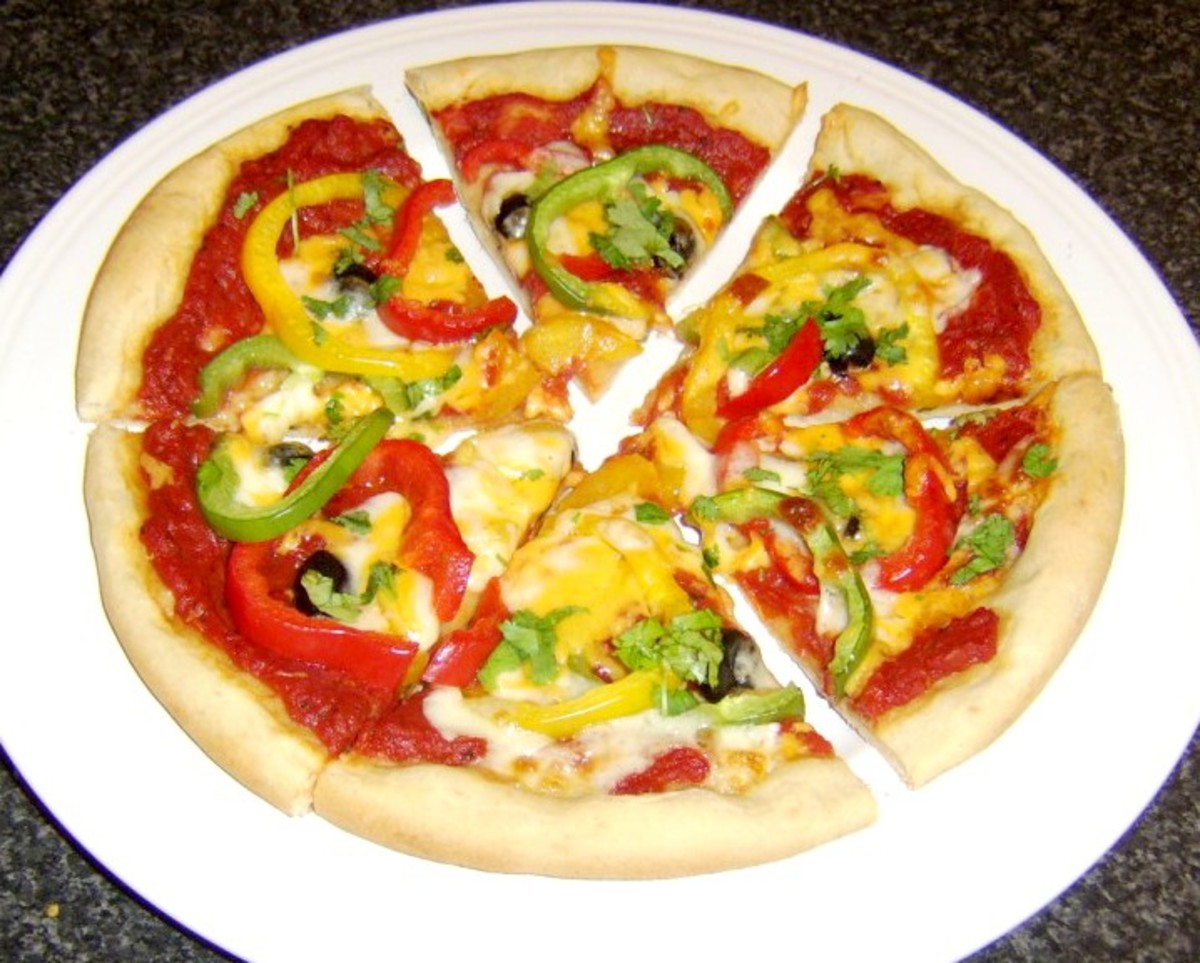 Mixed bell peppers and black olive pizza
