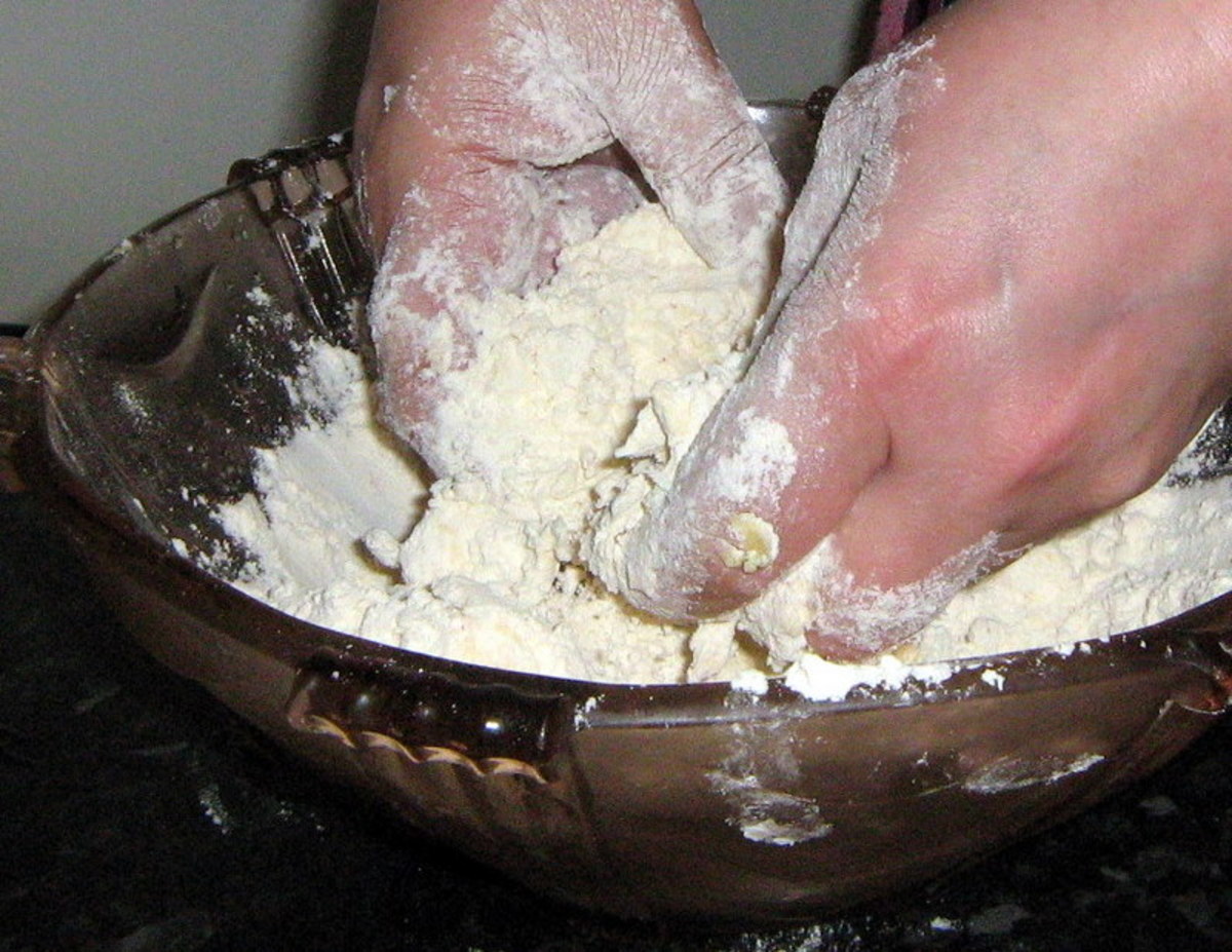 Add the butter to the flour and mix in with your fingertips. Do this as quickly as possible until the mixture is a crumbly texture.
