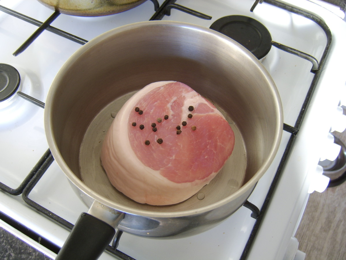 Ham is boiled simply in water with whole black peppercorns
