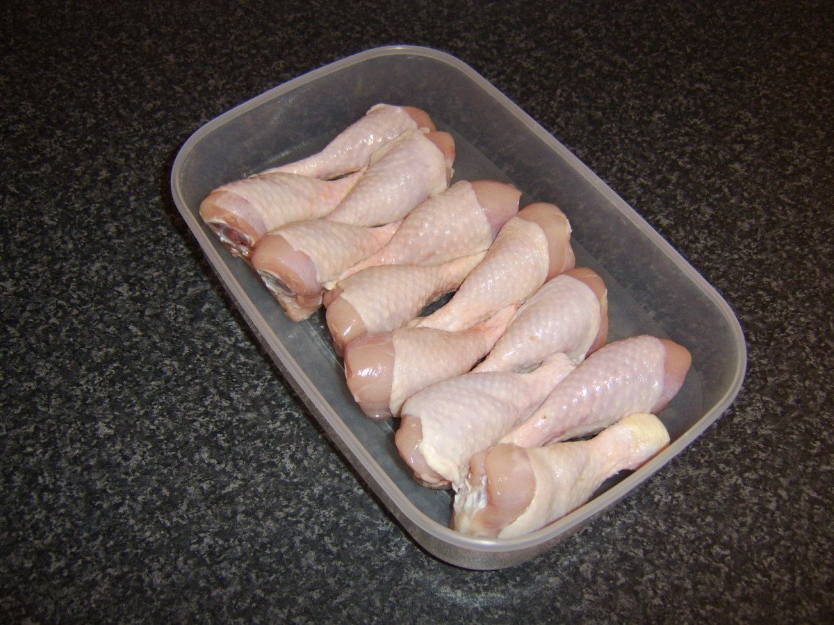 If the chicken drumsticks have been frozen, they should be fully defrosted in the refrigerator prior to being cooked