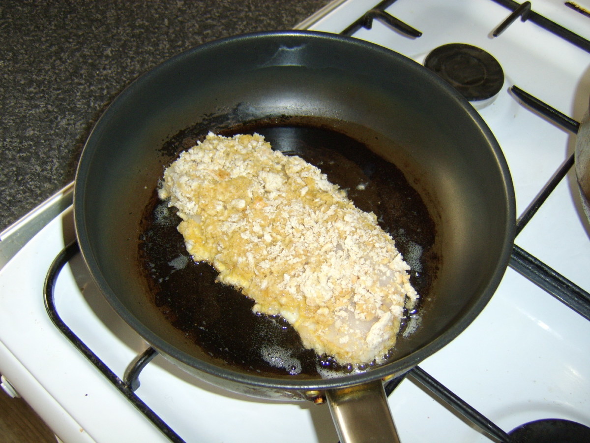The breaded whiting fillet is shallow fried in vegetable oil.