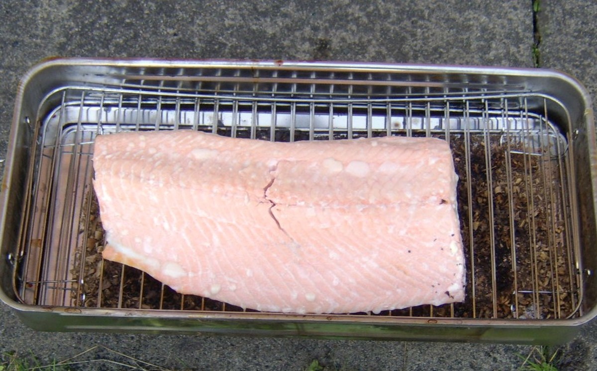 Using a sharp knife to cut in to the salmon allows you to tell when it is ready