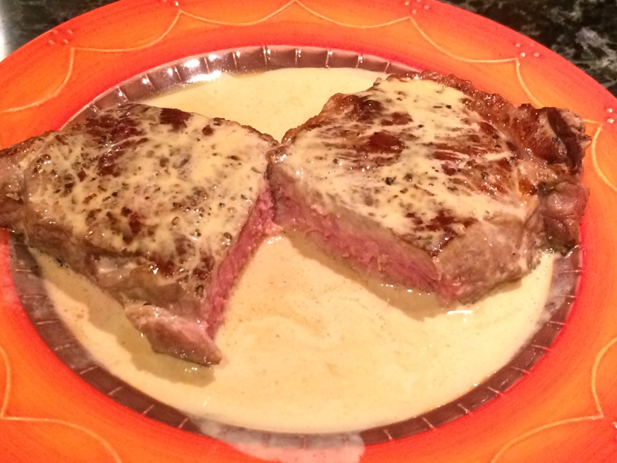 A perfectly cooked rib-eye steak with cognac cream sauce