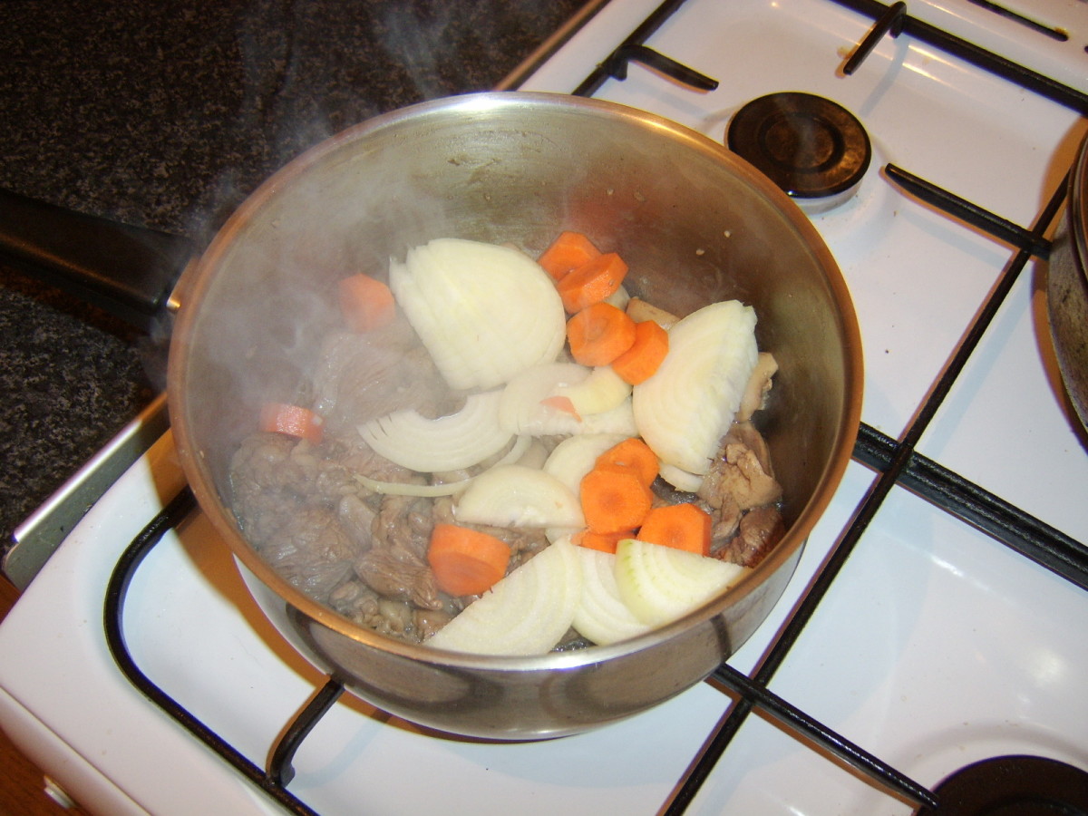 Sliced carrot and onion are added to the steak and kidney