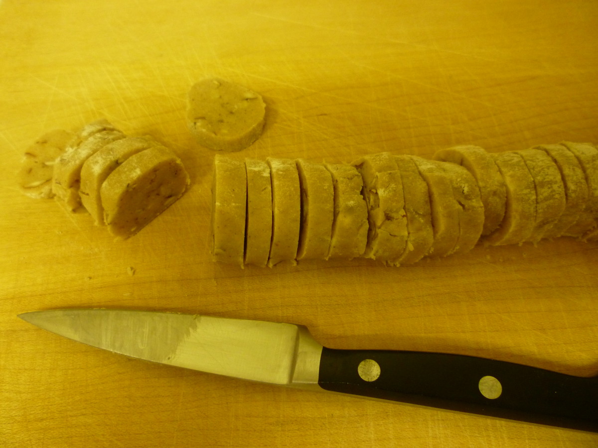 Slicing the rolls of ice box cookies.