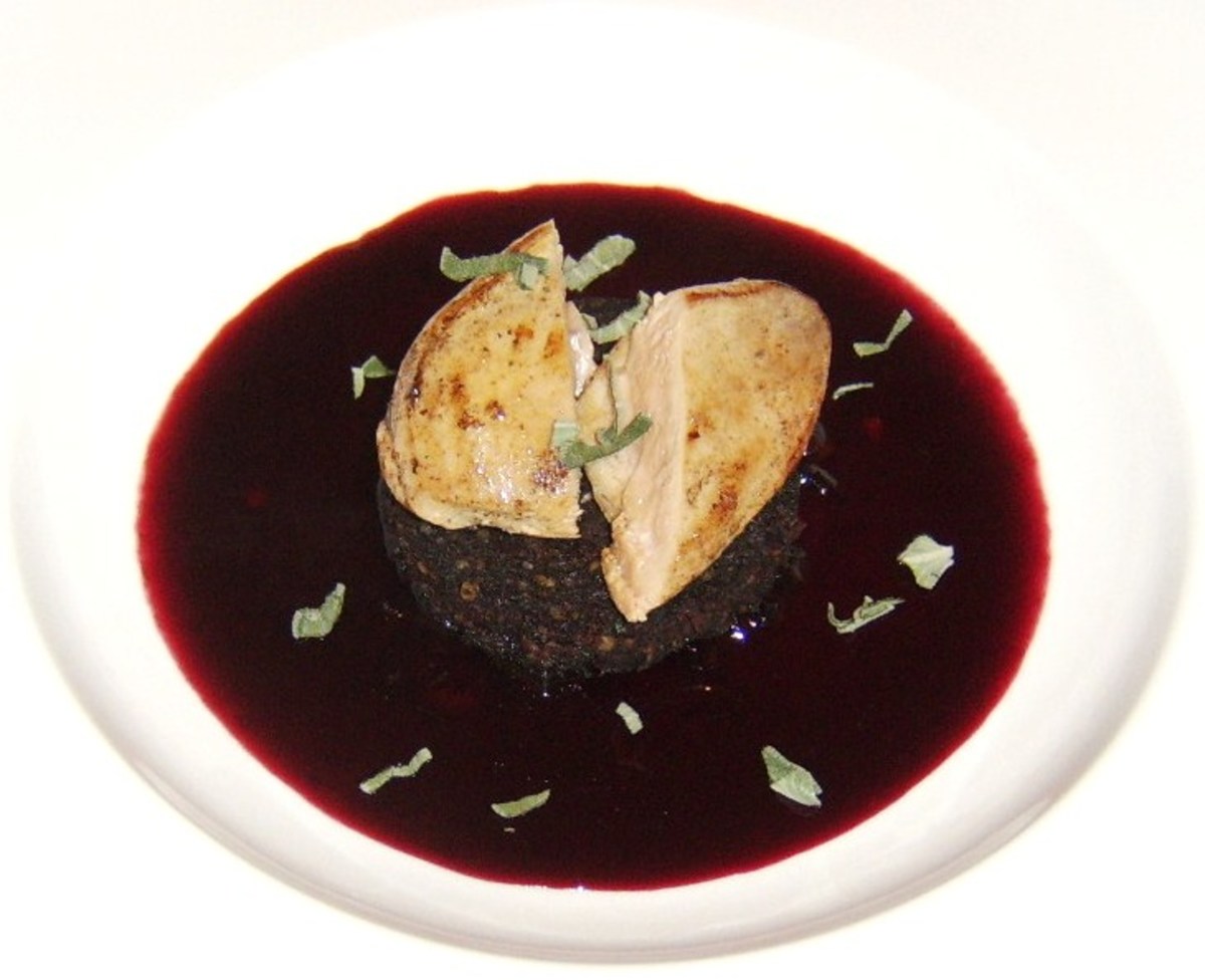 Pan fried partridge breast, served on a slice of black pudding with a red wine and cranberry sauce