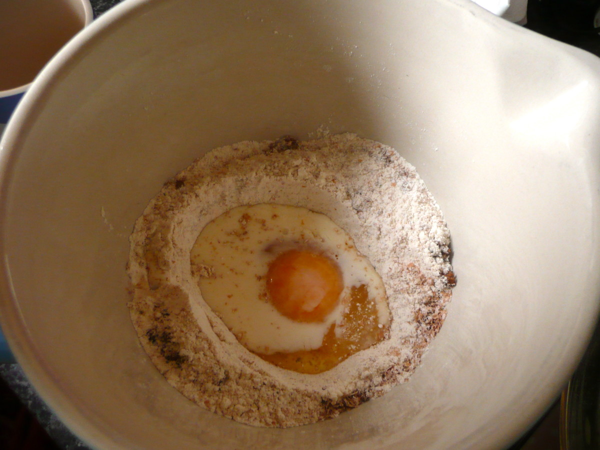 Make a well in the dry ingredients and add the egg and most of the milk.