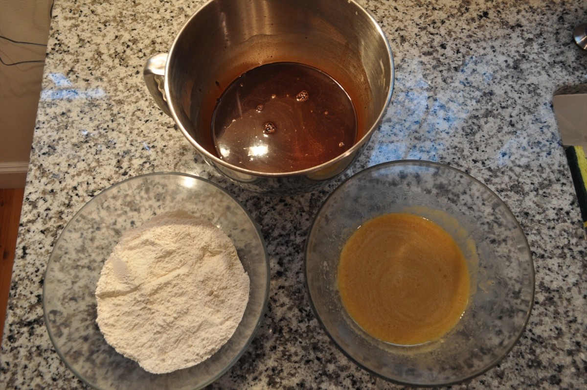 The white flour mixture (instruction #3), the brown chocolate mixture (instruction #4), and the yellow egg mixture (instruction #5) are ready for combining (instructions #6 and #7).