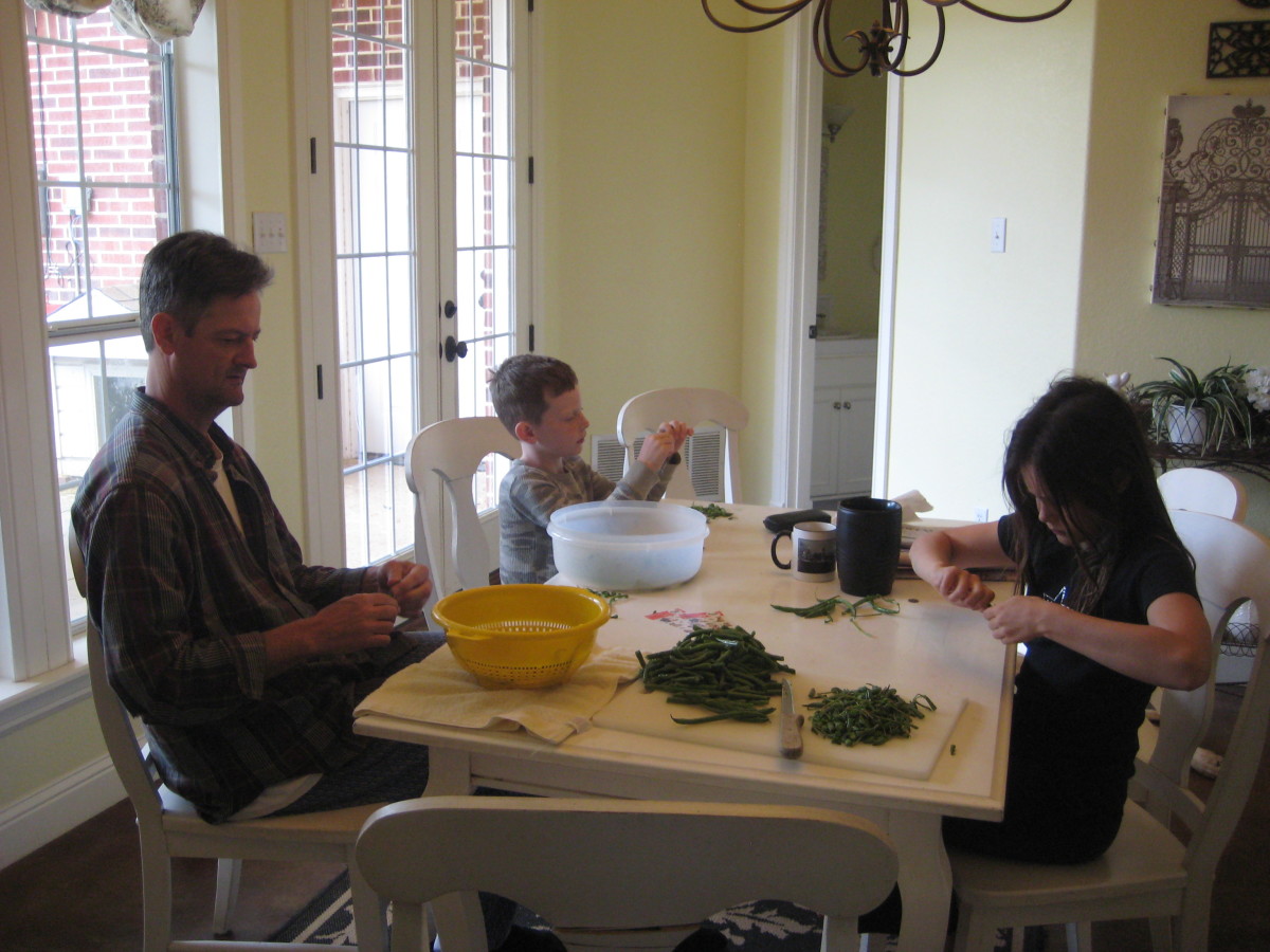 Snapping beans by yourself can get tedious, but when done as a family project, it's actually fun, relaxing, and a great opportunity to tell jokes and stories.