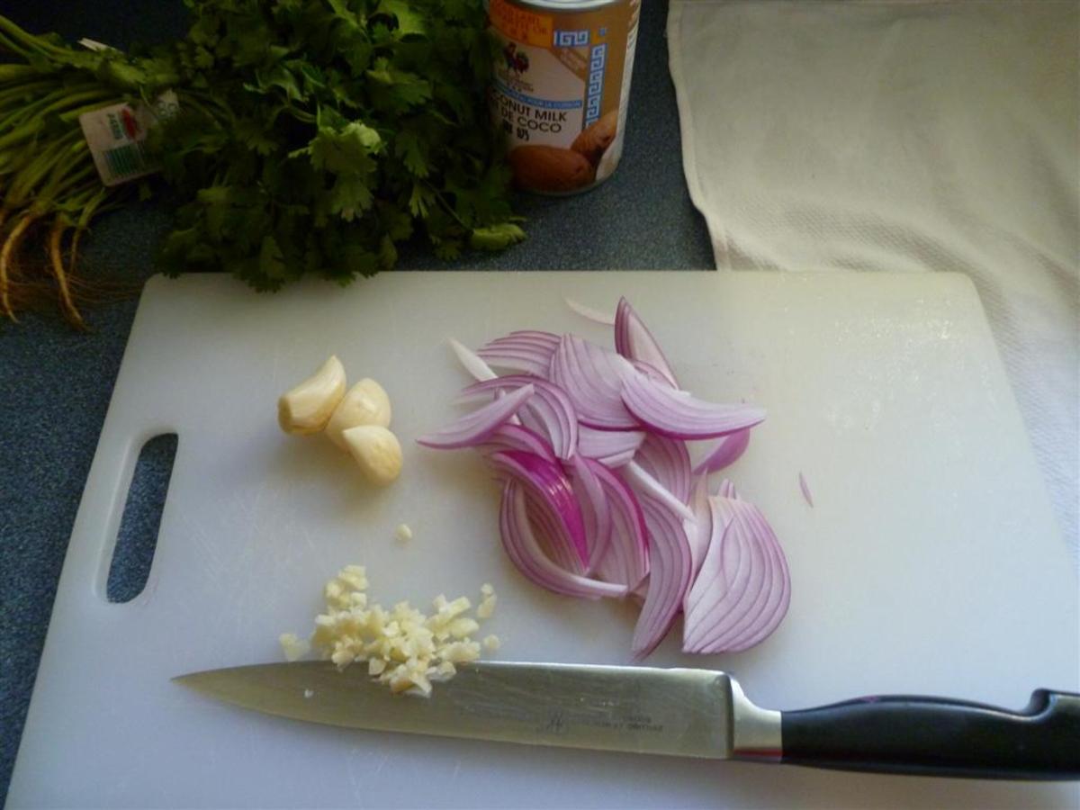Thinly slice the red onion and crush and chop the garlic.