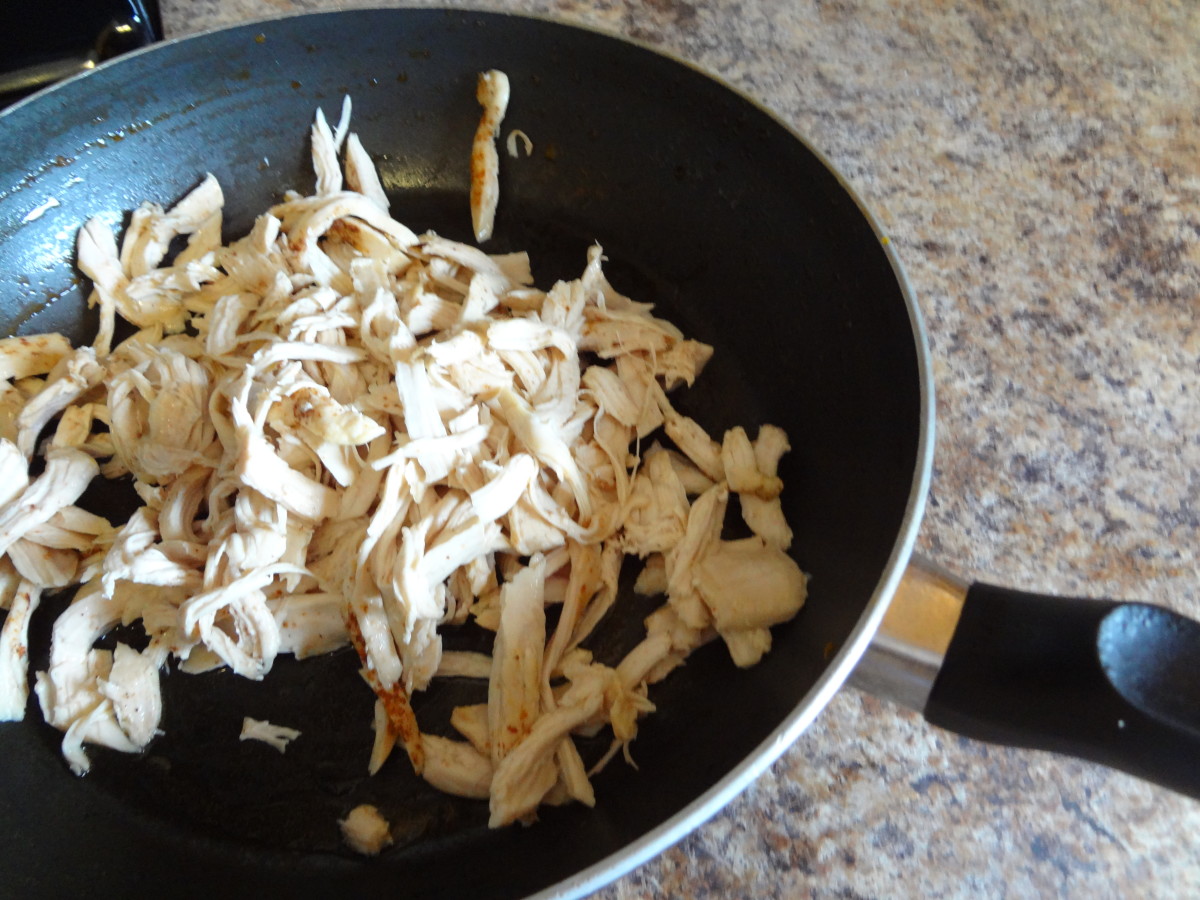 Put the shredded chicken and more seasoning into a frying pan to lock in the flavor.