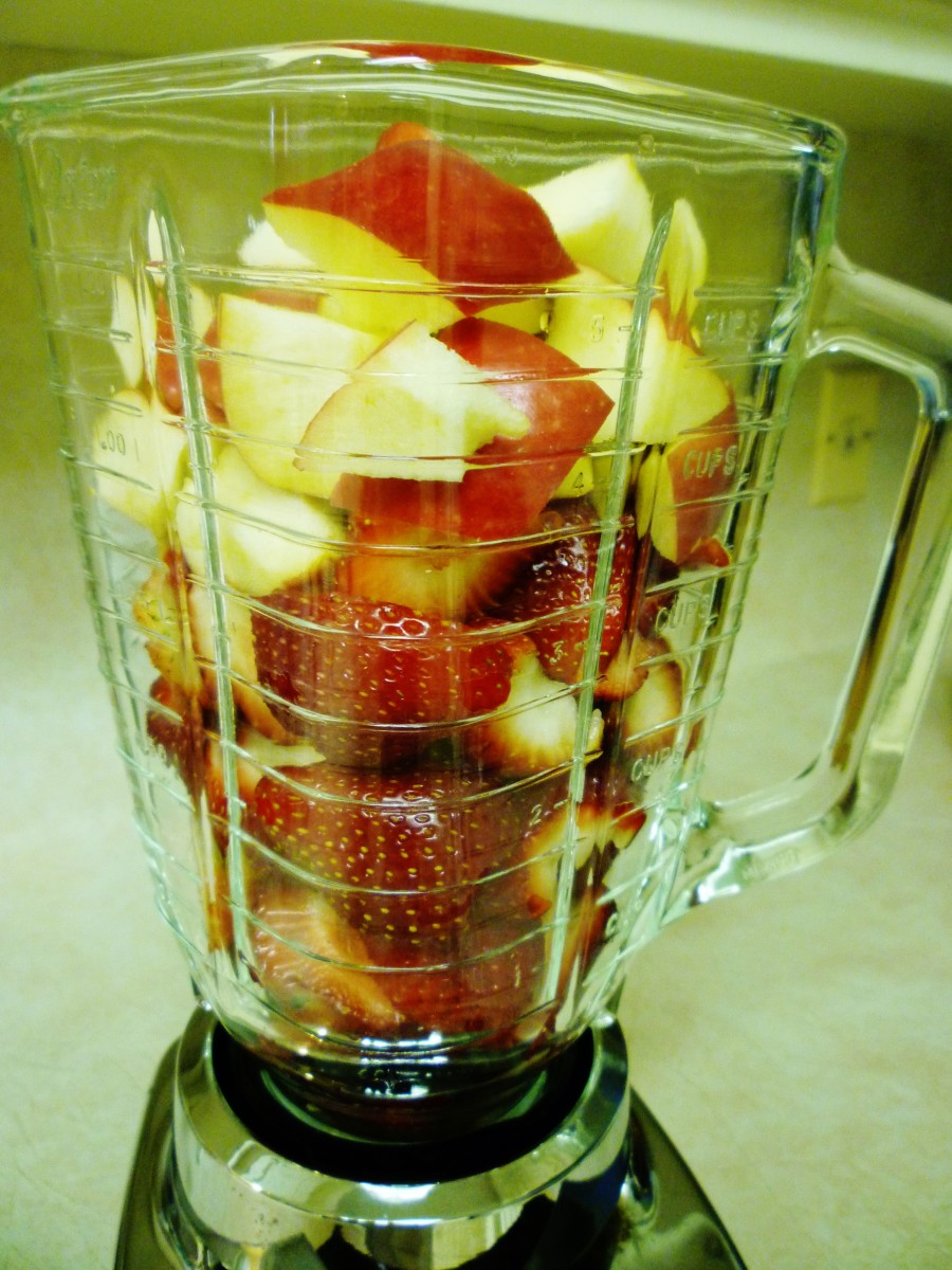 Strawberries and apple in the blender