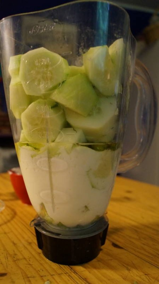 Layer all ingredients for cucumber soup into the blender.