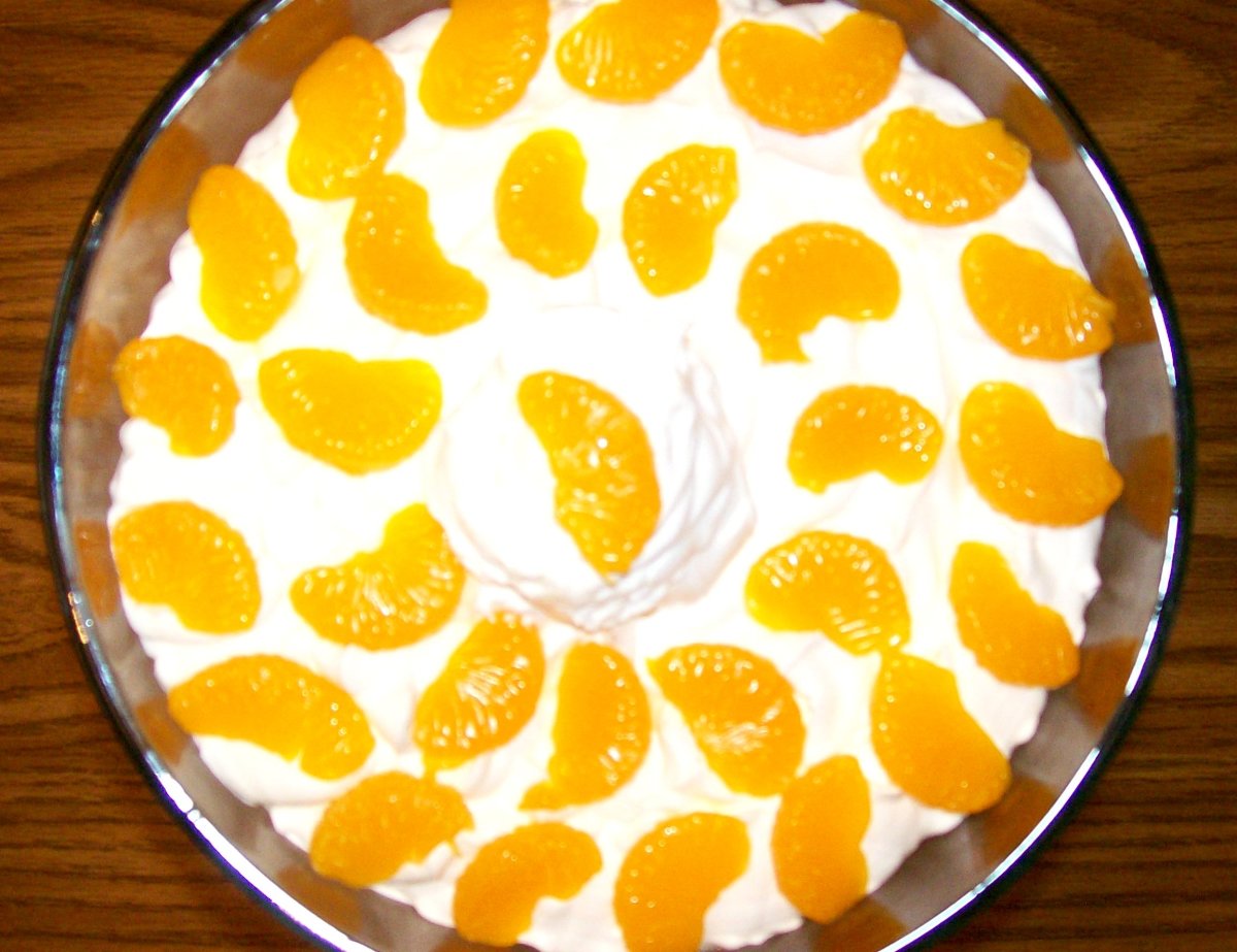 Arrange the orange slices atop the trifle decoratively for extra visual appeal.