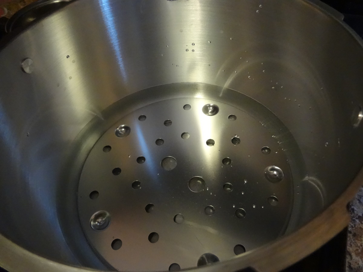 Add a few inches of water to the pressure cooker.