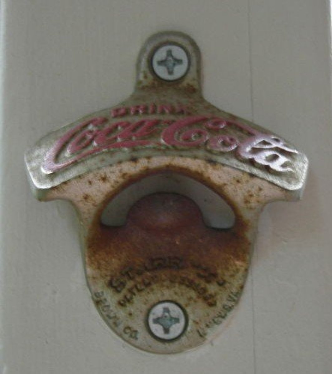 Vintage Coca-Cola bottle opener, wall-mounted