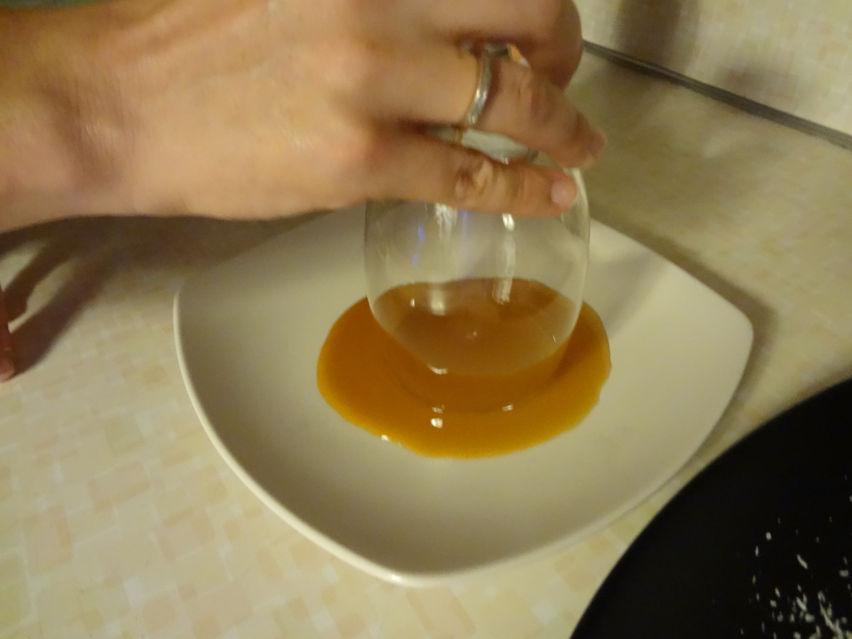 Dip the glass in the caramel or other liquid.