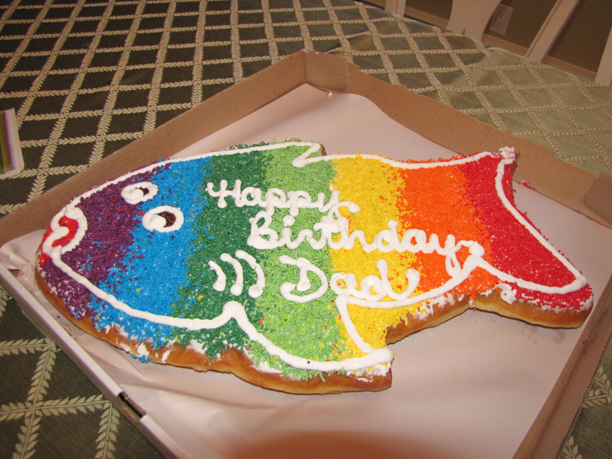 This fish-shaped donut cake probably appeals to the recipient's love of fishing!