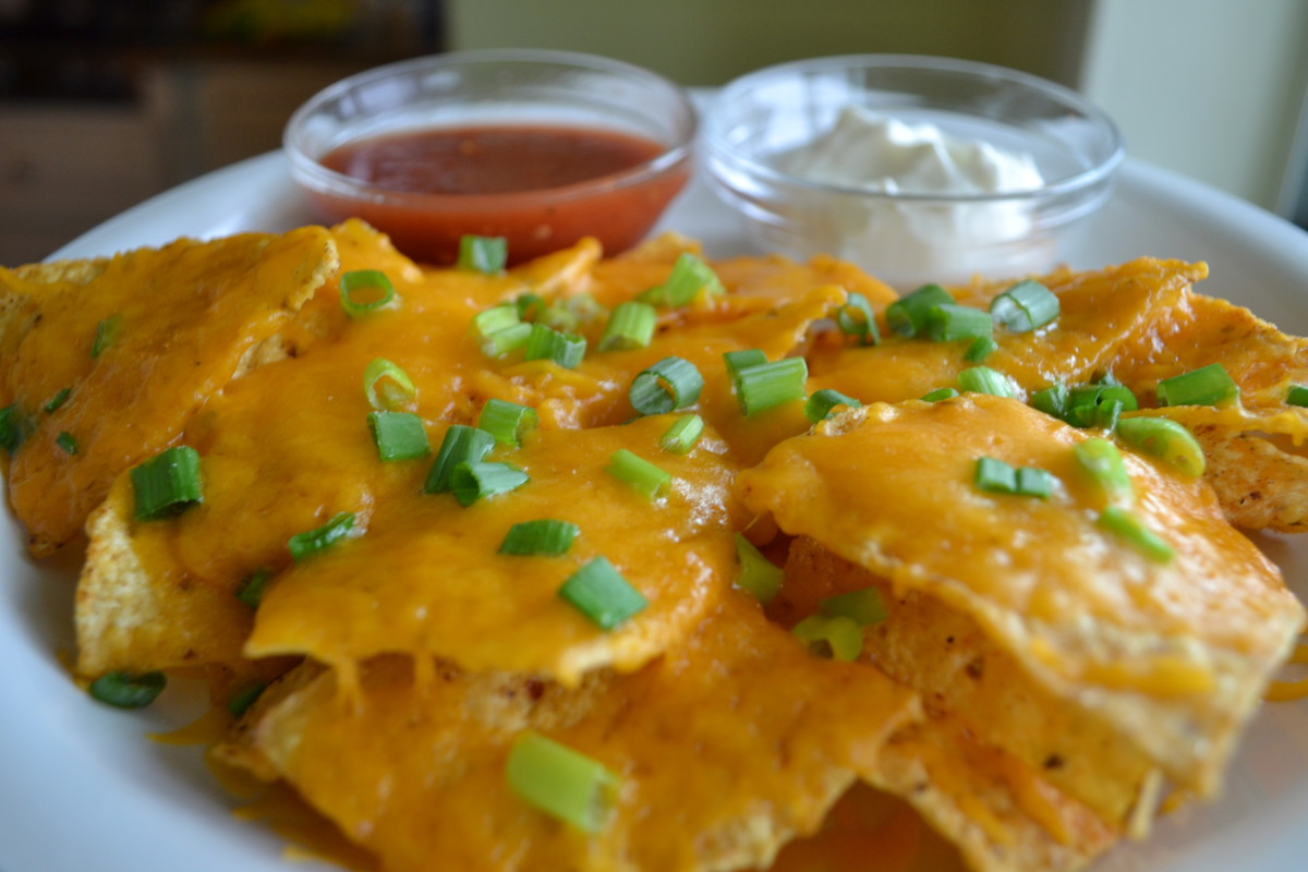 Nachos made with Julio's Chips are the best! Julio's Salsa and sour cream perfectly complement the chips-cheese-green onion combination.