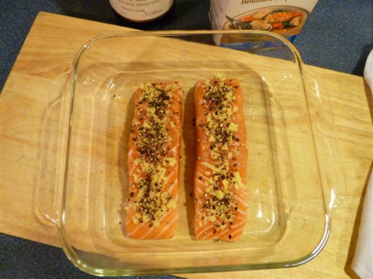 Sprinkle the chopped ginger and crushed peppercorns evenly over the tops of the 4 fillets.
