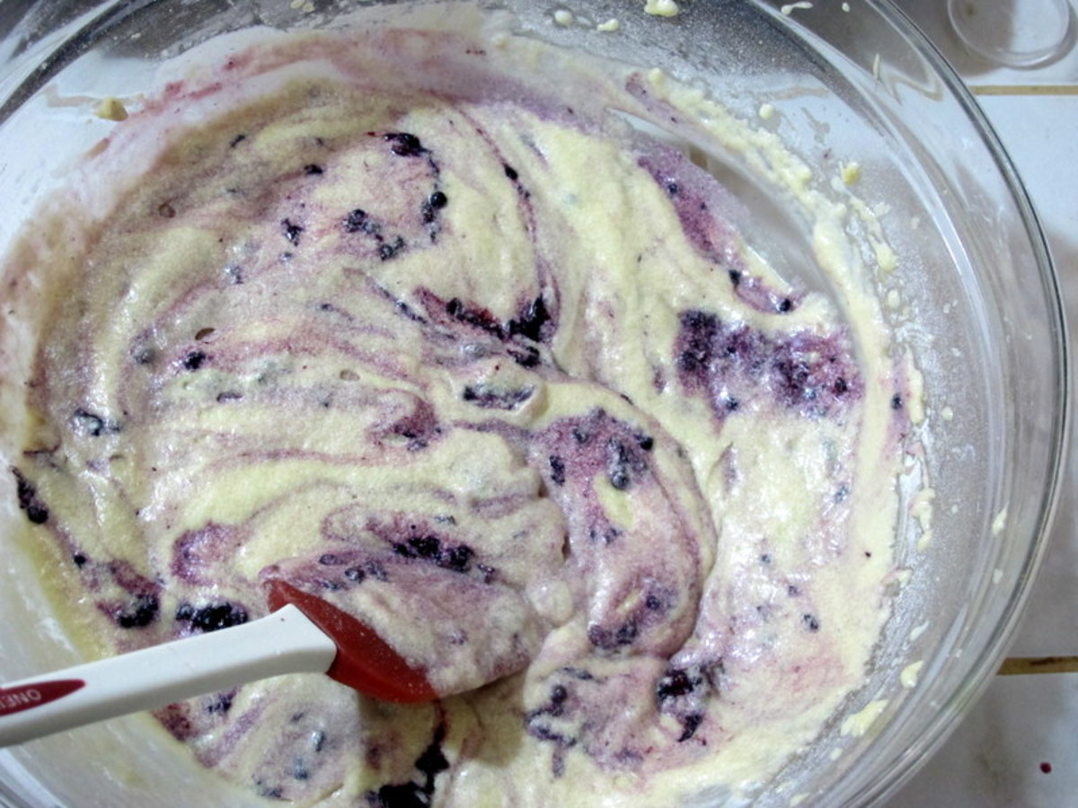 Fold mashed berries into the batter.