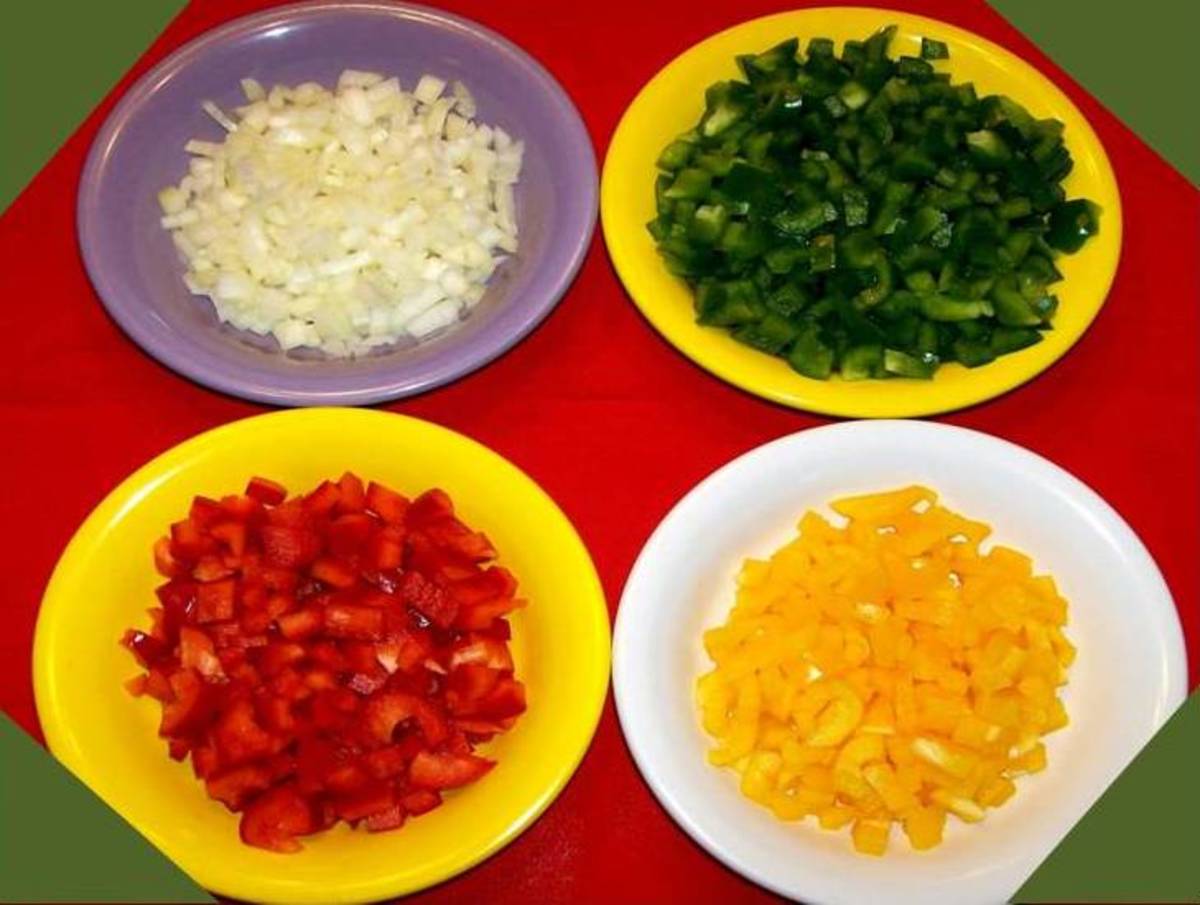 Add 1 cup of onion, 1 cup each of yellow and red bell peppers, and 2 cups of green bell peppers.