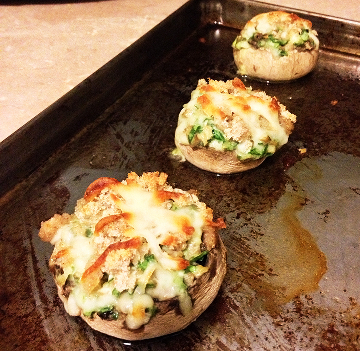Stuffed mushroom caps fresh out of the oven and still bubbly hot!