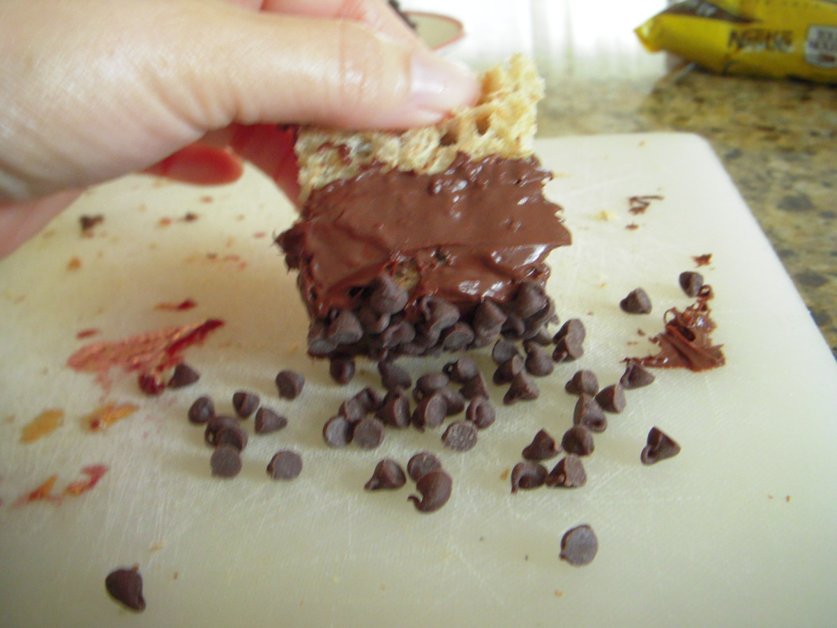 Press mini chips into melted chocolate on each quarter sandwich to cover.