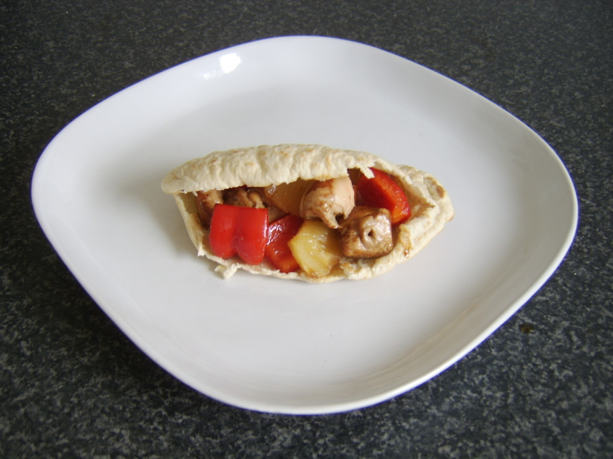 Soy spiced chicken and pineapple shish kebab in a pitta bread pocket