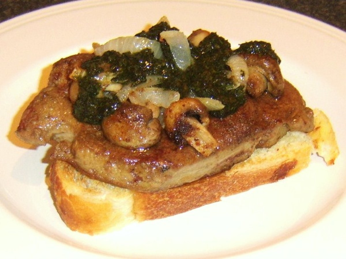 Ox liver slice on toast with onions, mushrooms and mint sauce.