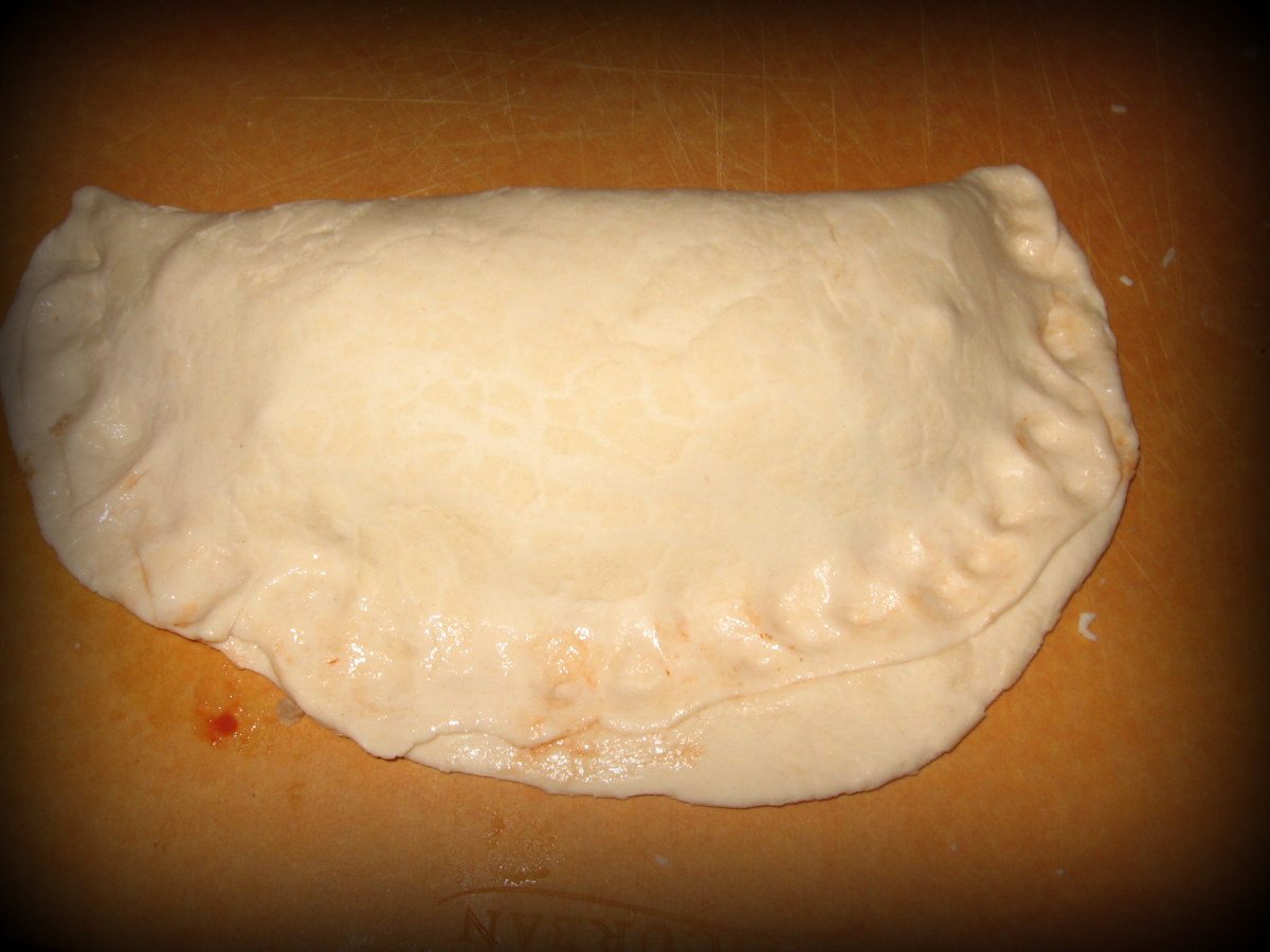 Fold the dough over and pinch the sides together. 