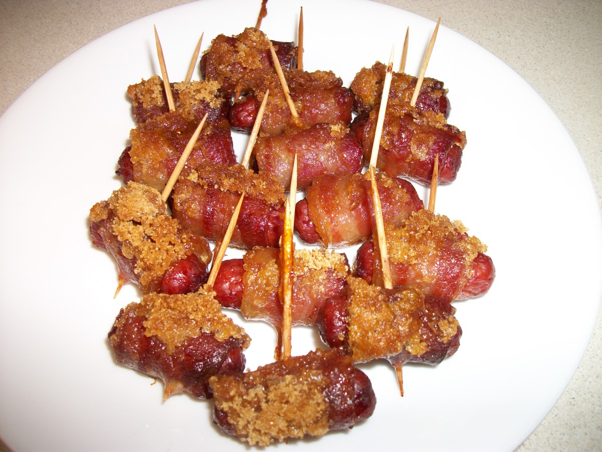 Here is a plate of Lit'l Smokies sausages wrapped in bacon and sprinkled with brown sugar.
