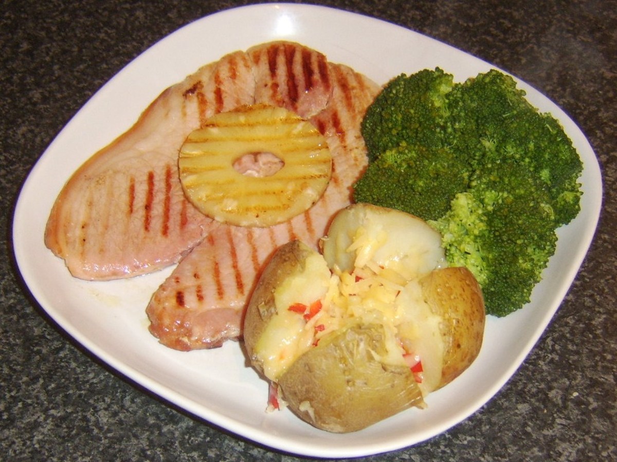 Smoked gammon steak with pineapple, spicy cheese baked potato and broccoli