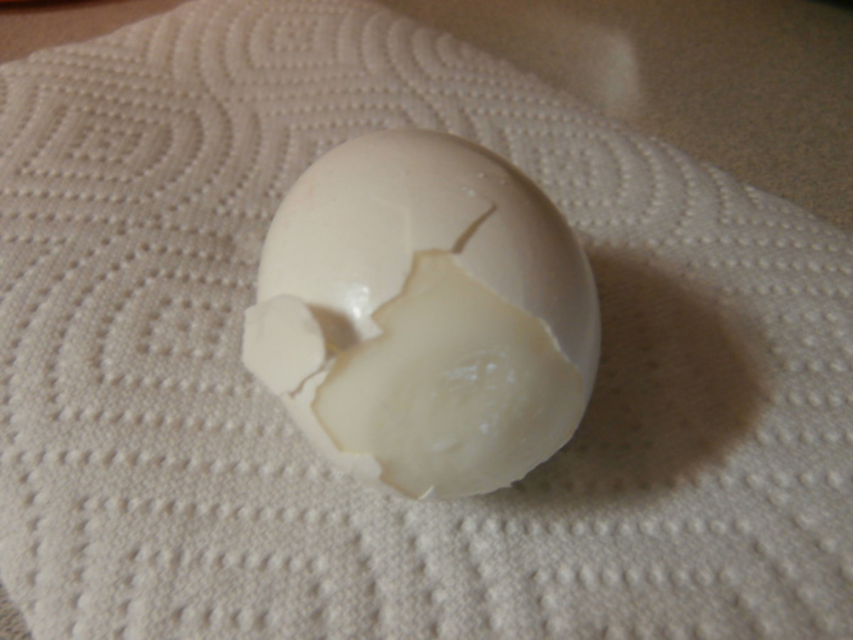 Carefully peel back the shell, starting at the air pocket, and making sure the thin membrane pulls away from the egg.