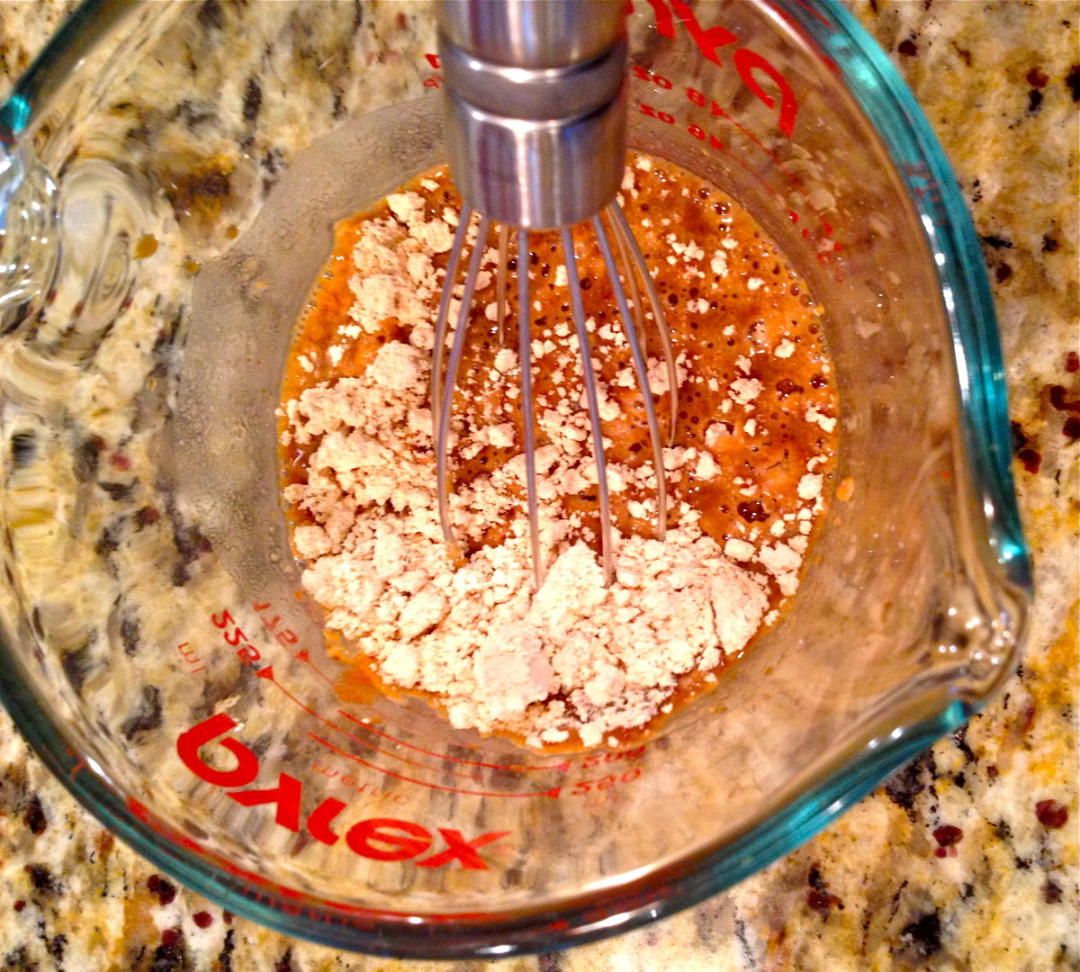 Combine Kentuckyaki sauce, hot water, PB2, Sriracha sauce, and ginger. Stir with a whisk.