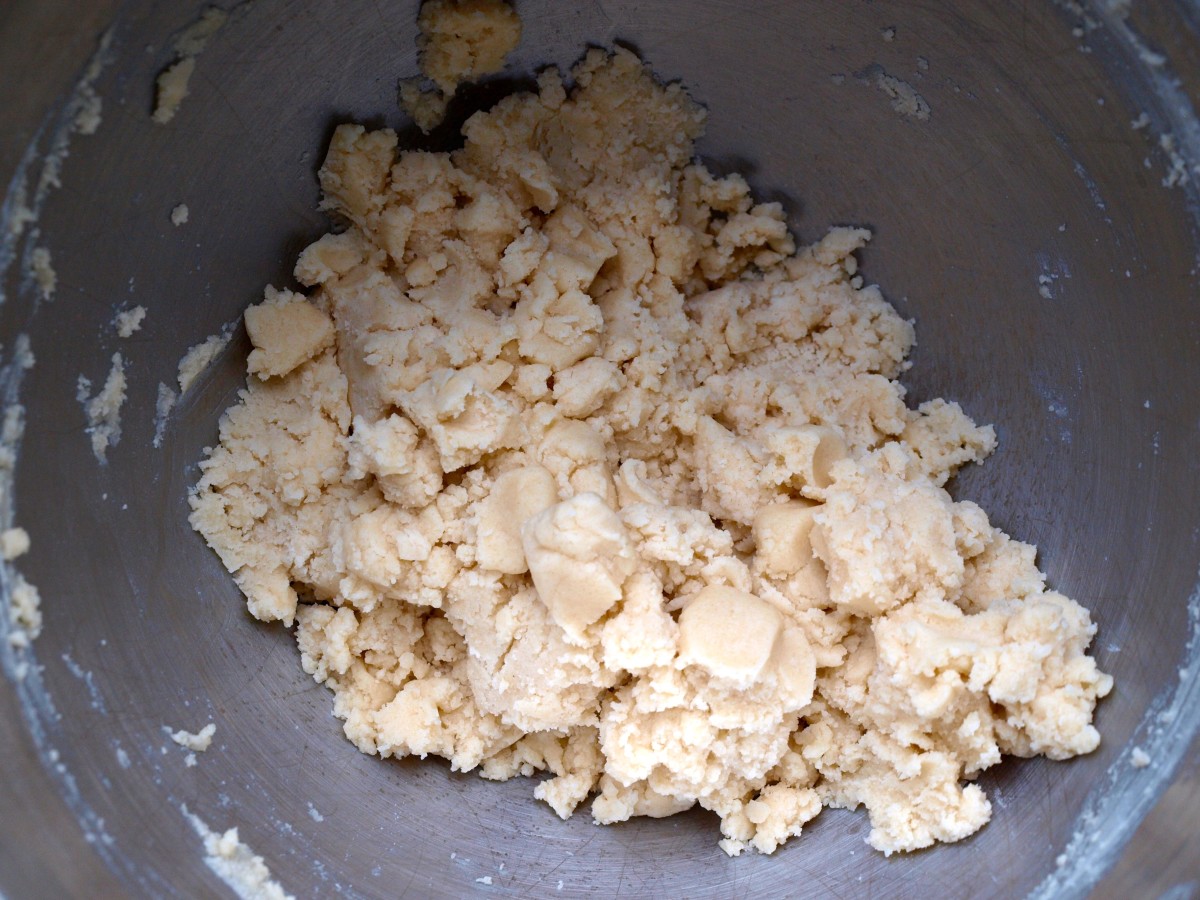 Make the cookie dough by combining butter, sugar, flour and orange zest.  When it looks like this in the mixer it's ready to use.