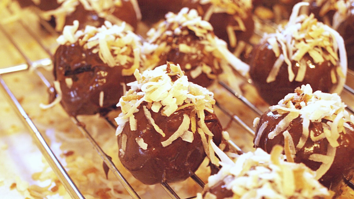 Sprinkle the toasted coconut on top of the dipped truffles before the chocolate hardens.