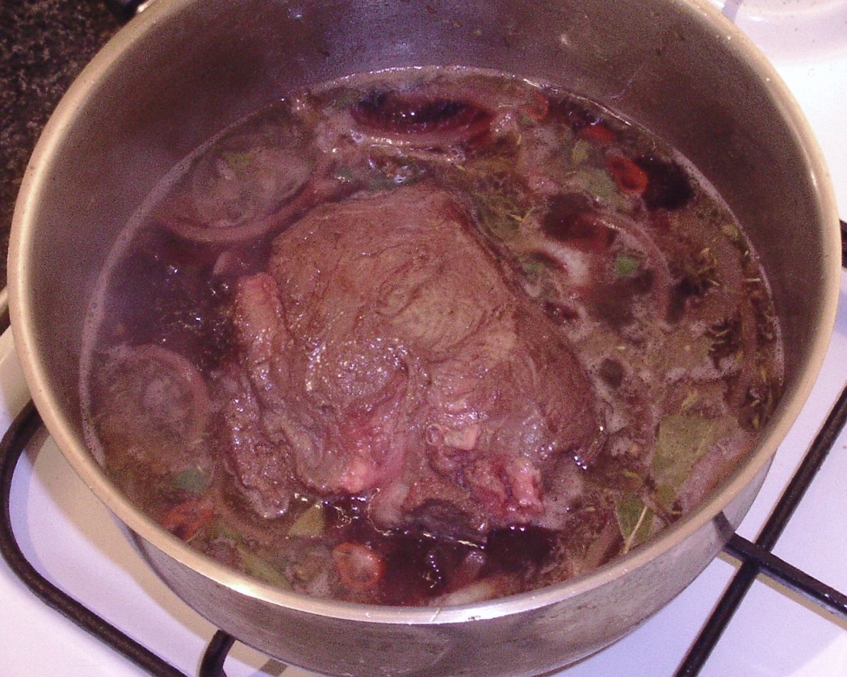 Ox cheeks are added to braising stock.
