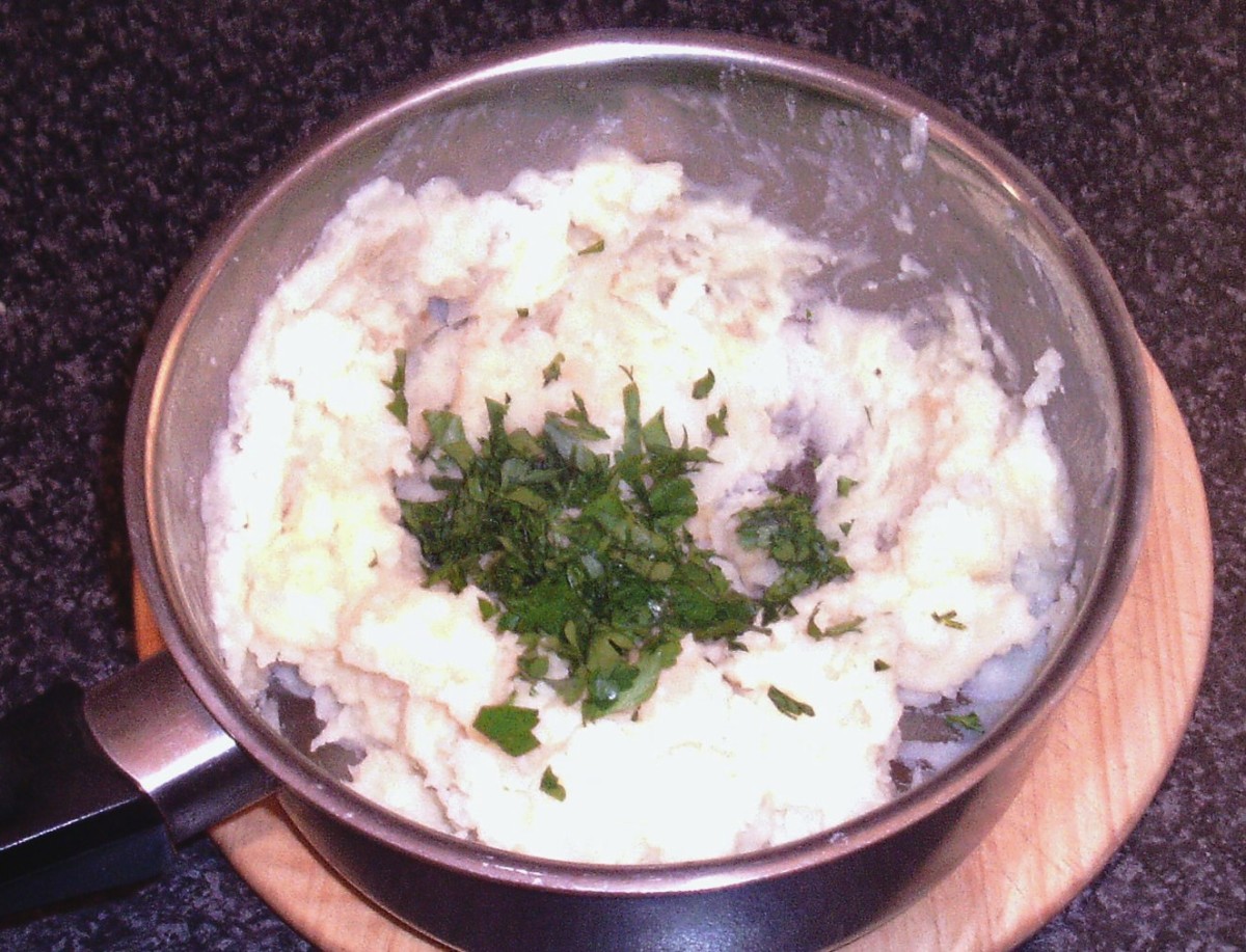 Chopped parsley is added to celeriac mash