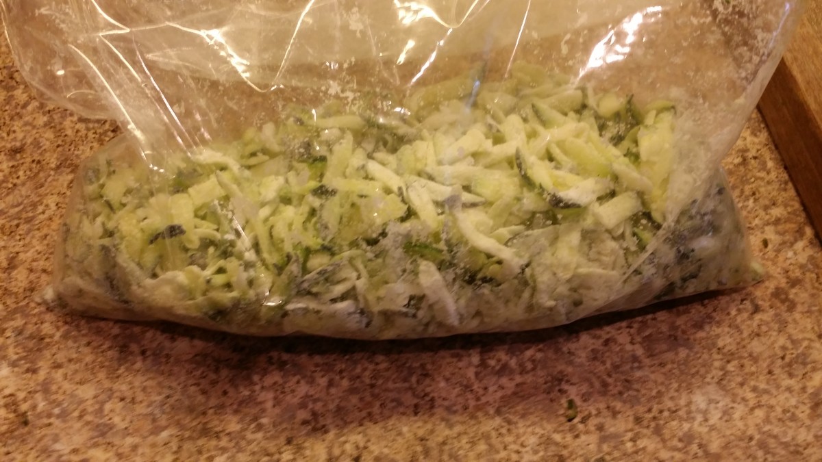 Coat the zucchini with the cornstarch in a bag.