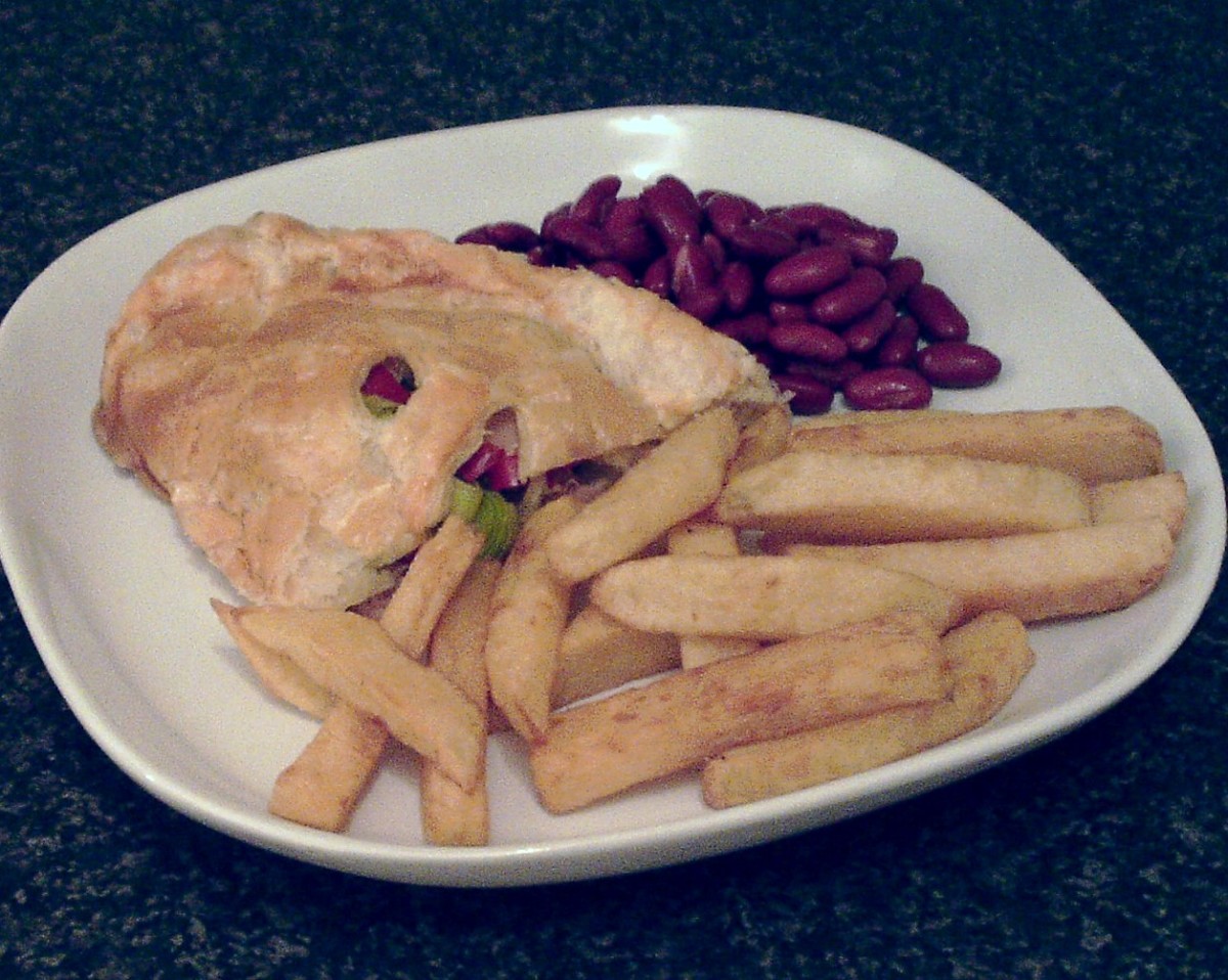 Spicy chicken and leek pasty half served with homemade chips and red kidney beans